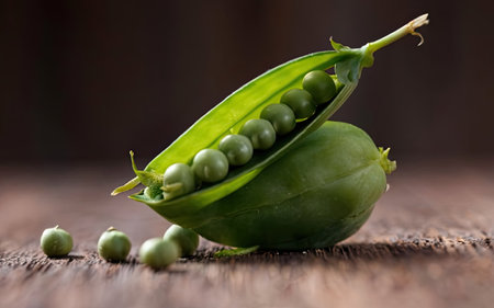 Pods of green peas on a wooden background. Selective focus.の素材