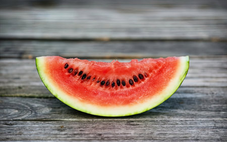 Sliced watermelon on a wooden background. Selective focus.の素材