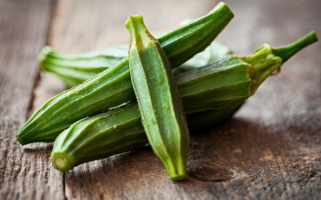 Fresh okra on wooden table. Fresh okra on wooden background.の素材