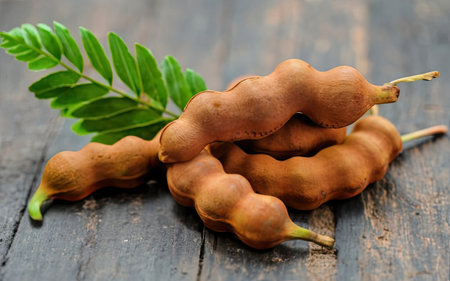 Fresh tamarind on wooden background,Tamarind indica L.の素材