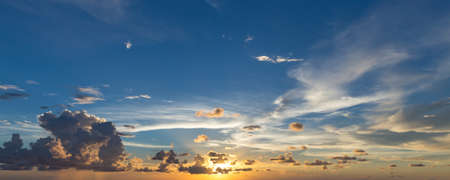 Evening sky with dramatic clouds over the sea.の写真素材
