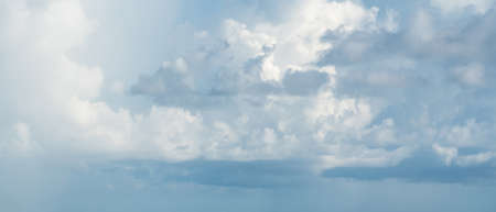 dense mass of clouds in a clear skyの写真素材
