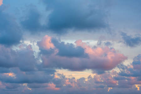 Sunset or dawn sky with pink and blue cloudsの写真素材