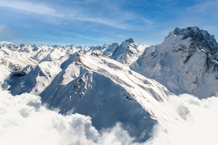 Beautiful view of a high mountain peak above the cloudsの写真素材