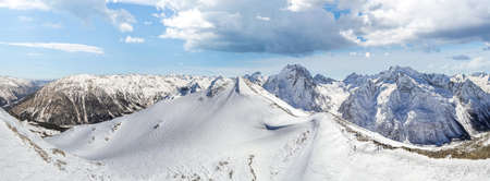 Mountain slope covered with snow in winterの写真素材