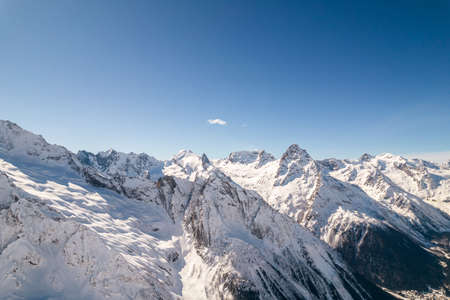 Snowy slopes of high mountainsの写真素材
