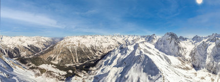 Mountain view with snow and cloudsの写真素材