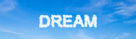 Dream word made of clouds on blue sky backgroundの写真素材