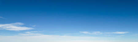 Panorama of blue sky with white foggy cloudsの写真素材