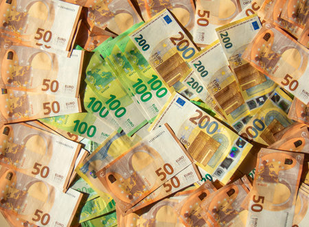 Euro cash banknotes of different denominations close-up texture