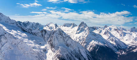 Panorama of winter snowy mountains in Caucasus region, Russiaの写真素材