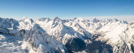 mountain peaks in the snow drone viewの写真素材