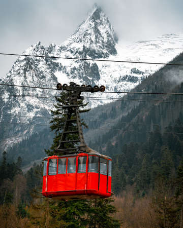 Cable car cabin in mountains with forestの写真素材