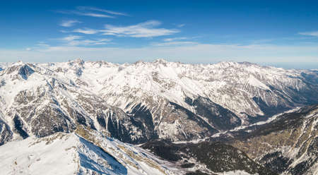 snowy mountains clouds and skyの写真素材