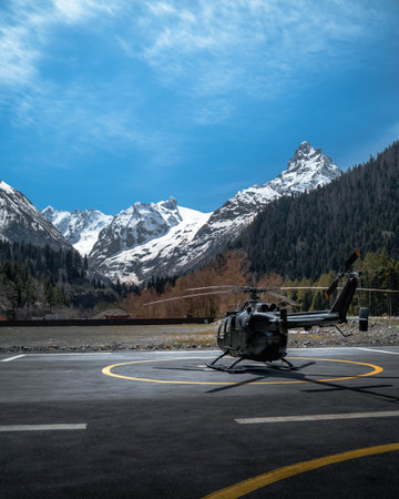 Helicopter landed on the base on the helipad in the mountainsの写真素材