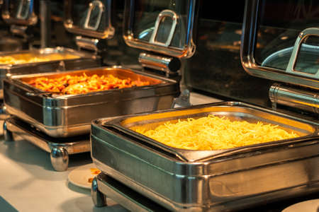 Buffet heated trays ready for service with pasta choice for breakfastの写真素材