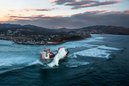 Container ship on stormy sea delivering cargoの写真素材