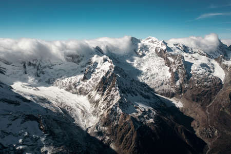 Snowy winter mountains with valley in Caucasus region in Russiaの写真素材
