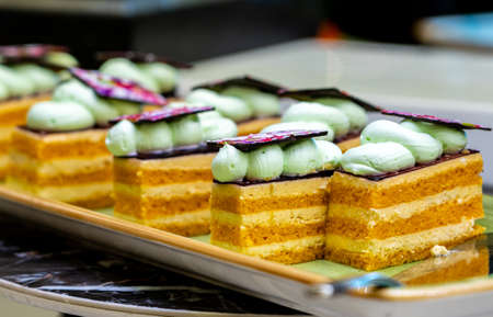Several puff small pieces of cakes on a plateの写真素材