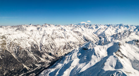mountain range with snow and skyの写真素材