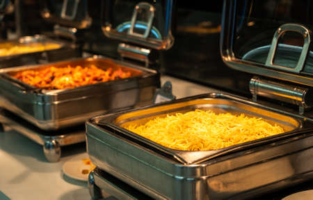 Buffet heated trays ready for service with pasta choice for breakfastの写真素材