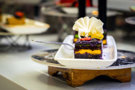 Chocolate mini cakes on a plate in the hotel minibarの写真素材