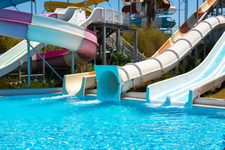 Slide in the water park with clear water in the poolの写真素材