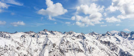 Panorama of winter snowy mountains in Caucasus region, Russiaの写真素材