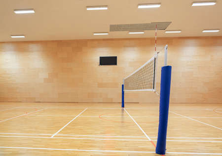 Volleyball net in the gym with the information board turned offの写真素材