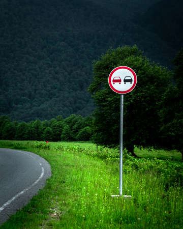 No Passing Zone Sign at the mountain roadの写真素材