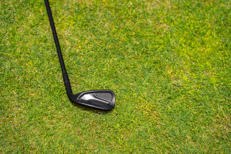 Top view of golf club on a green grass on golf courseの写真素材