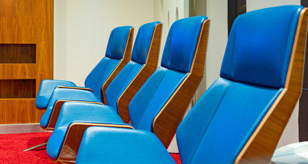 Row of business chairs in a meeting roomの写真素材