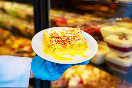 Sweet piece of yellow desert 3 milk on dishの写真素材