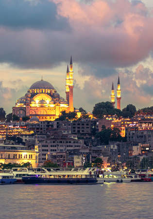 Suleymaniye Mosque with night illumination and minaret of Rustem Pasha Mosque, Istanbul, Turkeyの写真素材