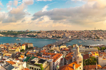 Istanbul skyline at sunset, Turkey. Panoramic view of Galata bridge, Golden Horn and old Fatih districtの写真素材