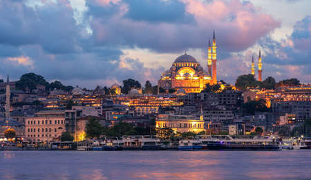 Suleymaniye Mosque with night illumination and minaret of Rustem Pasha Mosque, Istanbul, Turkeyの写真素材
