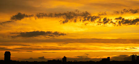 Fiery orange sky with clouds sunset in the eastの写真素材