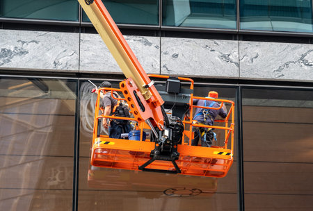 Window cleaners use tower to clean the windows of a skyscraper in New York