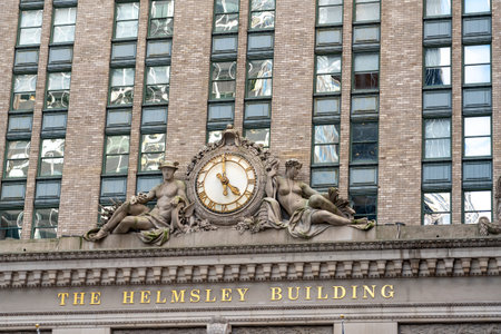 New York City, United States - September 20, 2022. Antique clock, statues and name on the Helmsley Buildingのeditorial素材