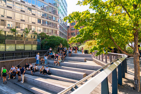 New York City, United States - September 18, 2022. People resting in a designated area of Highline Parkのeditorial素材