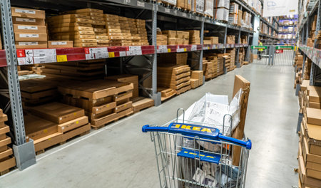 Belgrade, Serbia - January 02, 2023: Shopping cart with Ikea logo in store warehouse