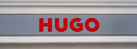 Vienna, Austria - December 10, 2022: Shop window of Hugo sign with the name of the storeのeditorial素材
