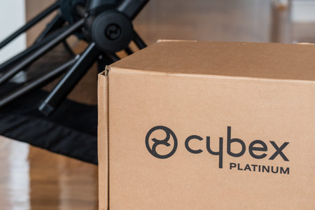Novi Sad, Serbia - 15 January, 2023: Logo of Cybex platinum brand on cardboard box with stroller on...