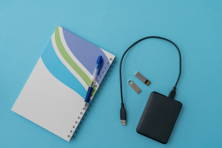 Items for storing information traditional notebook and pen and digital mediaの写真素材