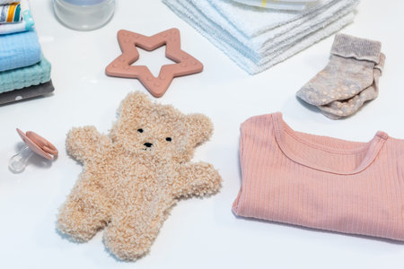 Set of baby clothes and accessories on white background. Newborn concept. Flat lay, top view