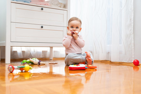 A bright room in which the baby plays with toysの写真素材