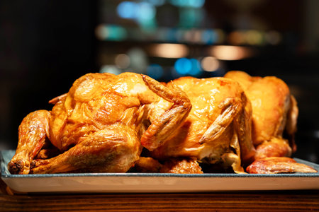 Perfectly grilled delicious chicken with golden crustの写真素材
