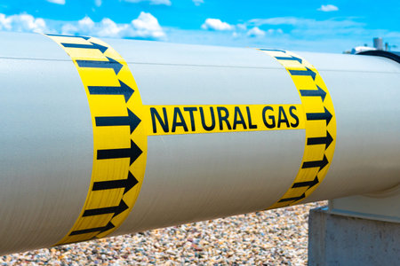 A huge diameter gas pipeline with a gas transportation direction indicator and the inscription...