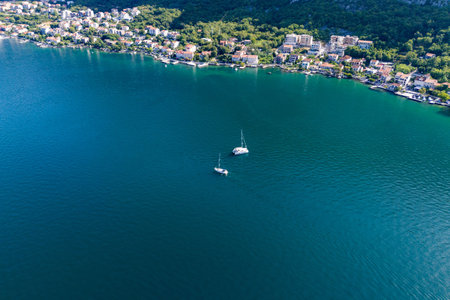 A pair of yachts at anchor off the coast. The concept of active and luxurious recreationの写真素材