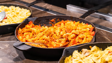 Hearty fusilli pasta in a homemade tomato sauce, offering a delicious taste of traditional Italian cuisine.の写真素材